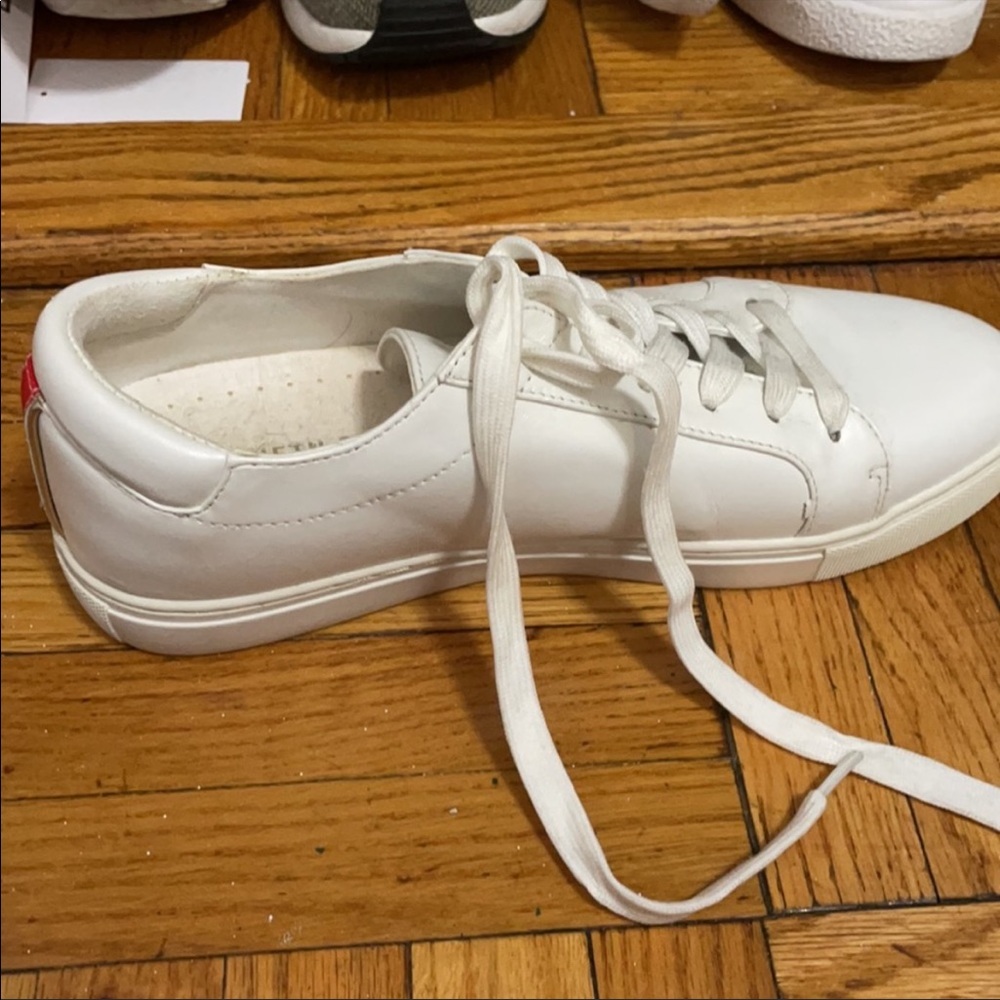 Cole Haan white sneaker with back rainbow stripe. Great condition. Size 7.